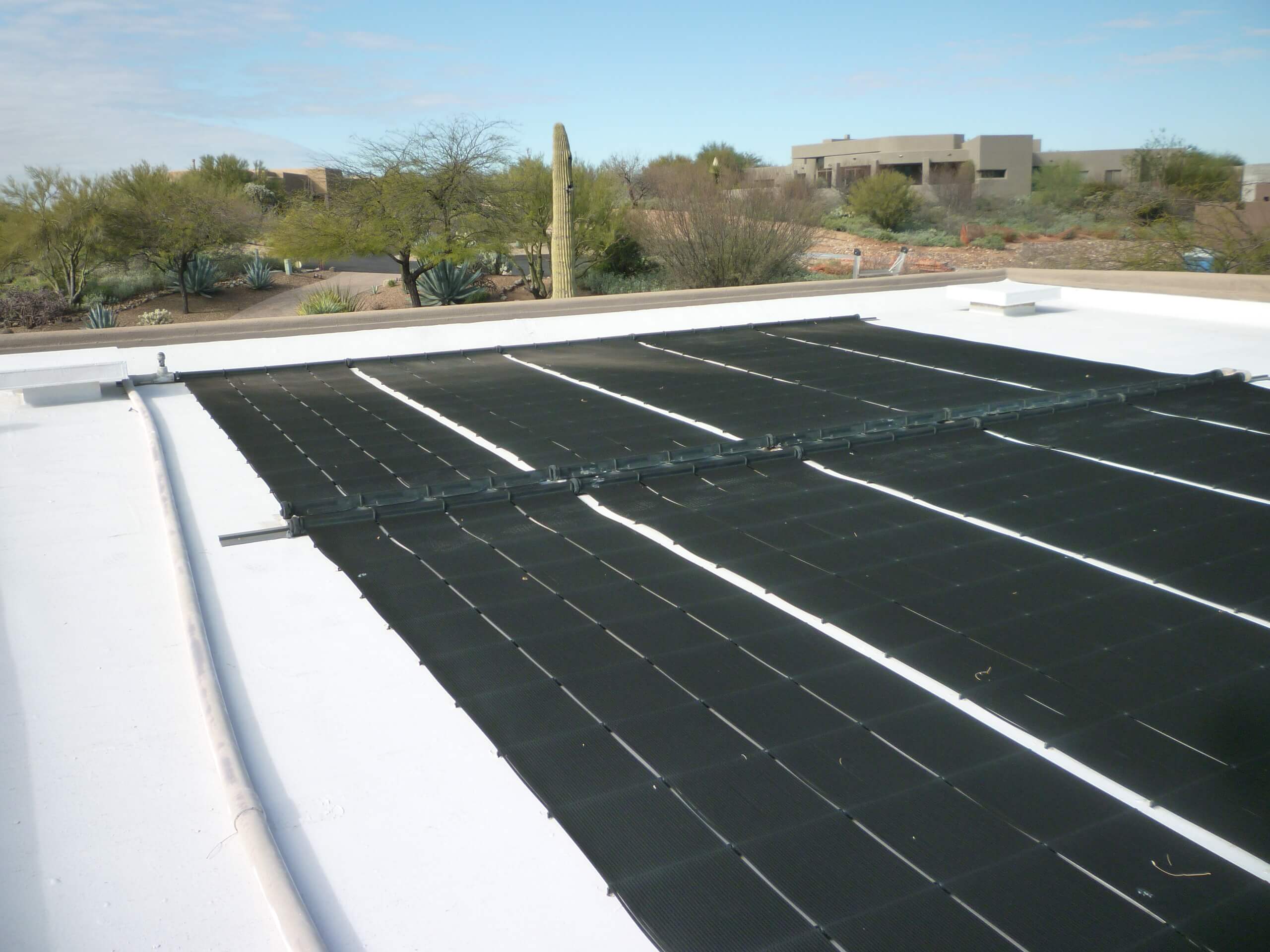 Sunsplash solar pool heating panel on roof